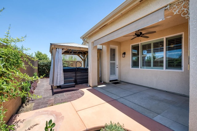 629 Del Monte Ave, Clovis, CA 93619 - fenced backyard with a hot tub, a gazebo, a patio, and a ceiling fan