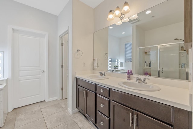 1066 Jade Way, Lemoore, CA 93245 - bathroom with double vanity, a shower stall, and tile patterned floors