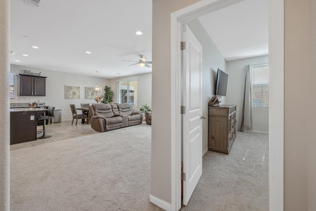 1066 Jade Way, Lemoore, CA 93245 - hallway with light colored carpet, plenty of natural light, and recessed lighting