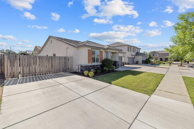1066 Jade Way, Lemoore, CA 93245 - traditional home with driveway, stucco siding, an attached garage, and a tile roof
