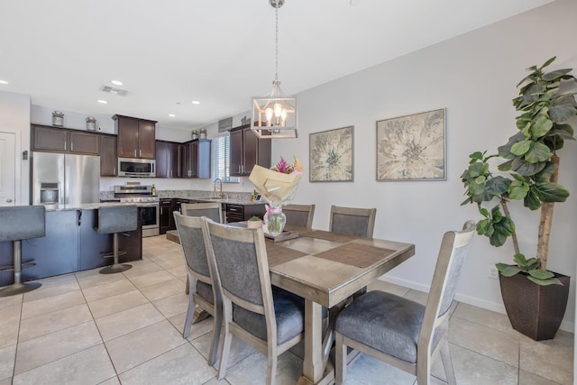 1066 Jade Way, Lemoore, CA 93245 - dining area featuring light tile patterned flooring, a chandelier, and recessed lighting