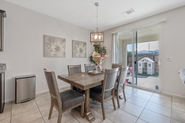 1066 Jade Way, Lemoore, CA 93245 - dining space featuring a chandelier and light tile patterned flooring