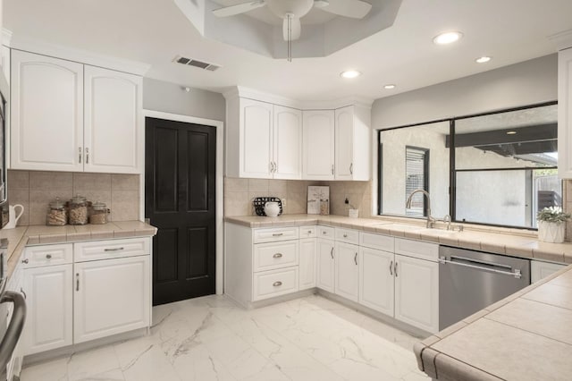 8501 N Akron Ave, Fresno, CA 93720 - kitchen featuring dishwasher, white cabinets, recessed lighting, a ceiling fan, and light marble finish floors