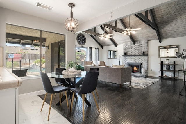 8501 N Akron Ave, Fresno, CA 93720 - dining room with a brick fireplace and a ceiling fan