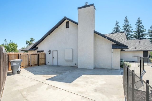 8501 N Akron Ave, Fresno, CA 93720 - back of house with a patio area, stucco siding, and a chimney