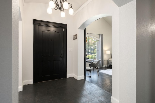 8501 N Akron Ave, Fresno, CA 93720 - entryway featuring arched walkways, a chandelier, and a textured wall