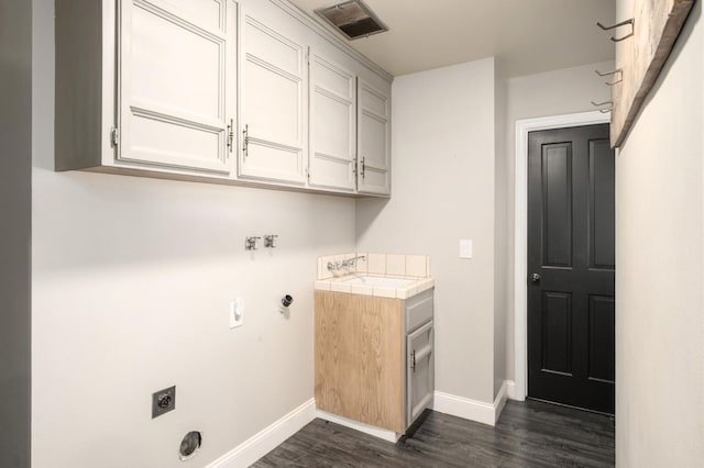 8501 N Akron Ave, Fresno, CA 93720 - laundry room featuring hookup for an electric dryer, dark wood-style flooring, cabinet space, and gas dryer hookup