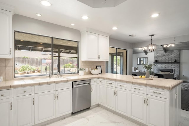 8501 N Akron Ave, Fresno, CA 93720 - kitchen with dishwasher, a peninsula, recessed lighting, plenty of natural light, and white cabinets