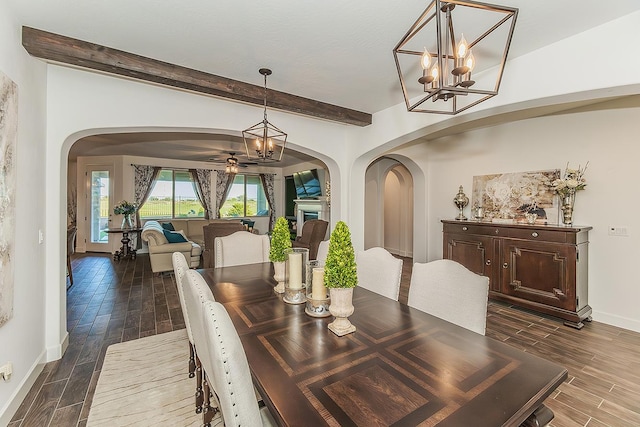 400 Ridge Creek Estates Way, Dinuba, CA 93618 - dining room with dark wood-type flooring, beam ceiling, arched walkways, a chandelier, and ceiling fan