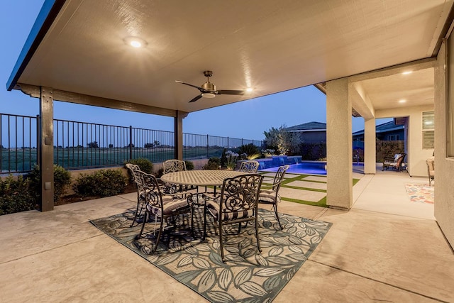 400 Ridge Creek Estates Way, Dinuba, CA 93618 - fenced backyard with a patio, a ceiling fan, and outdoor dining space