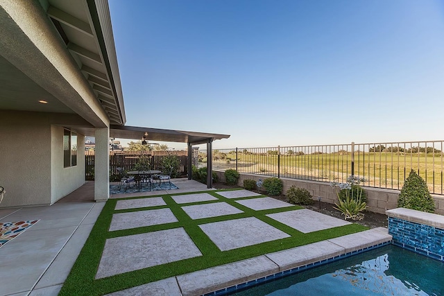 400 Ridge Creek Estates Way, Dinuba, CA 93618 - fenced backyard with a patio area and a ceiling fan