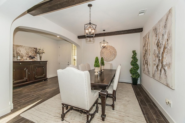 400 Ridge Creek Estates Way, Dinuba, CA 93618 - dining area with a chandelier, arched walkways, wood finished floors, and beamed ceiling