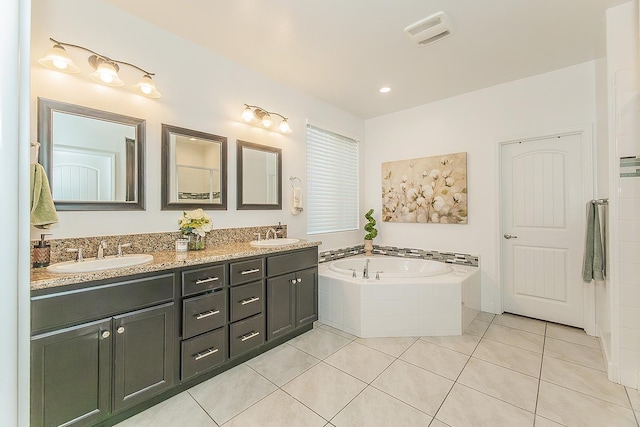 400 Ridge Creek Estates Way, Dinuba, CA 93618 - bathroom featuring a bath, double vanity, and tile patterned flooring