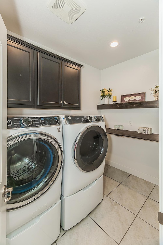 400 Ridge Creek Estates Way, Dinuba, CA 93618 - washroom featuring cabinet space, washing machine and dryer, light tile patterned floors, and recessed lighting