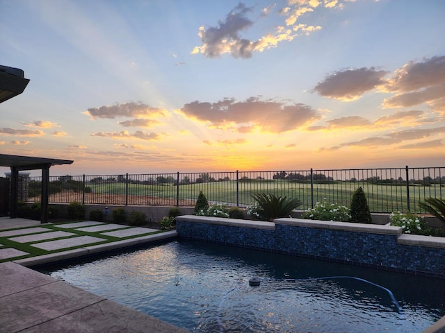 400 Ridge Creek Estates Way, Dinuba, CA 93618 - pool at dusk with a fenced backyard