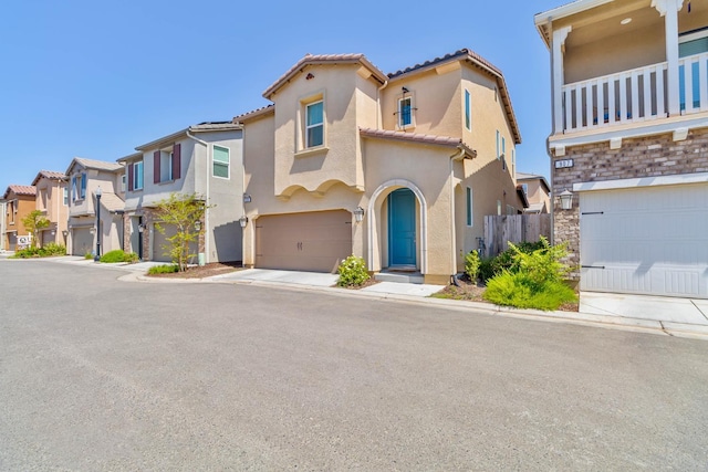 915 Winchell Way W, Madera, CA 93636 - view of front of house with a garage, a residential view, stucco siding, and a tile roof