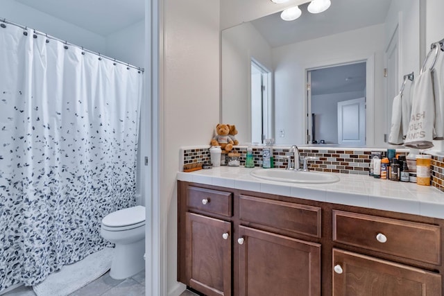 915 Winchell Way W, Madera, CA 93636 - bathroom with backsplash, vanity, and a shower with shower curtain