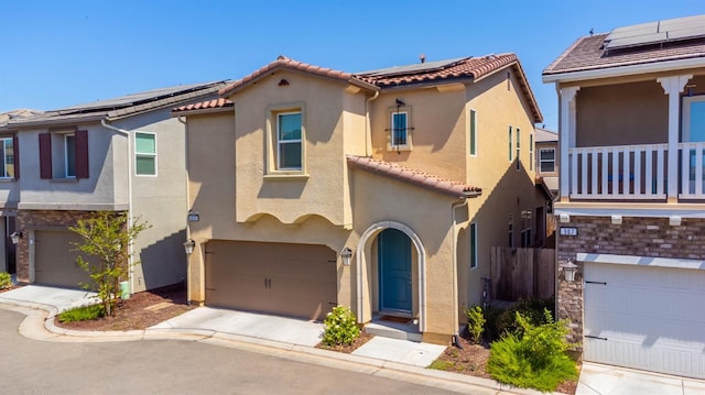 915 Winchell Way W, Madera, CA 93636 - view of front of property with stucco siding, a garage, solar panels, a tile roof, and driveway