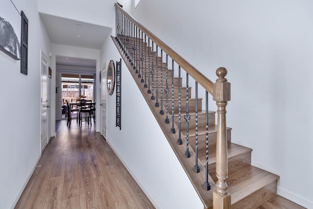 915 Winchell Way W, Madera, CA 93636 - staircase with wood finished floors and baseboards