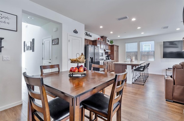 915 Winchell Way W, Madera, CA 93636 - dining room with light wood-type flooring and recessed lighting