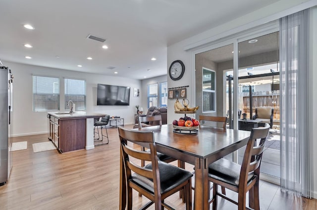 915 Winchell Way W, Madera, CA 93636 - dining area with light wood-style floors and recessed lighting