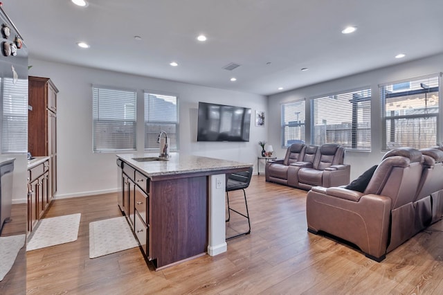 915 Winchell Way W, Madera, CA 93636 - living area with light wood-style flooring and recessed lighting