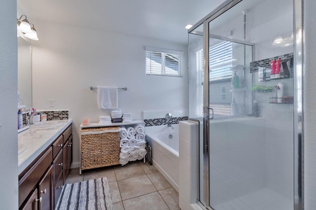 915 Winchell Way W, Madera, CA 93636 - bathroom with double vanity, a bath, tile patterned floors, and a stall shower