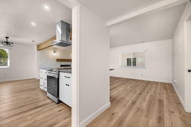 652 E Portals Ave, Fresno, CA 93710 - kitchen with stainless steel range with electric stovetop, wall chimney range hood, white cabinetry, light wood-style flooring, and recessed lighting