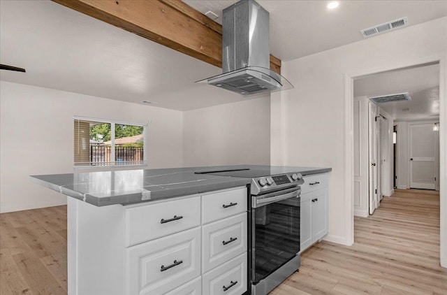 652 E Portals Ave, Fresno, CA 93710 - kitchen with stainless steel range with electric cooktop, island range hood, light wood finished floors, white cabinetry, and dark stone countertops