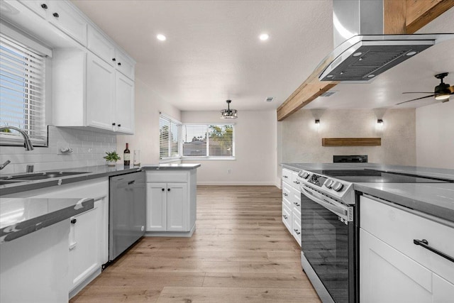 652 E Portals Ave, Fresno, CA 93710 - kitchen featuring stainless steel appliances, island exhaust hood, white cabinetry, light wood-style flooring, and dark countertops
