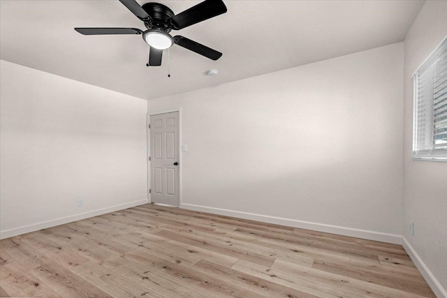 652 E Portals Ave, Fresno, CA 93710 - spare room with light wood finished floors, ceiling fan, and a smoke detector