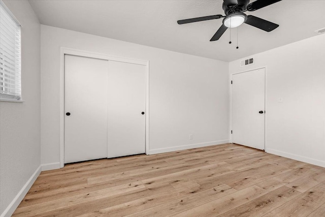 652 E Portals Ave, Fresno, CA 93710 - unfurnished bedroom with light wood-type flooring, a closet, and a ceiling fan