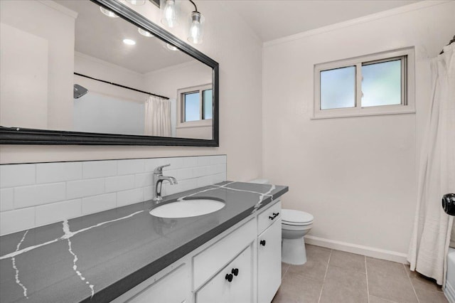 652 E Portals Ave, Fresno, CA 93710 - full bath featuring crown molding, vanity, plenty of natural light, tasteful backsplash, and tile patterned flooring