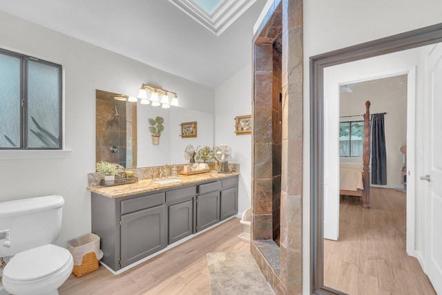 1750 E Deyoung, Fresno, CA 93720 - full bath featuring vanity, wood finished floors, and tiled shower
