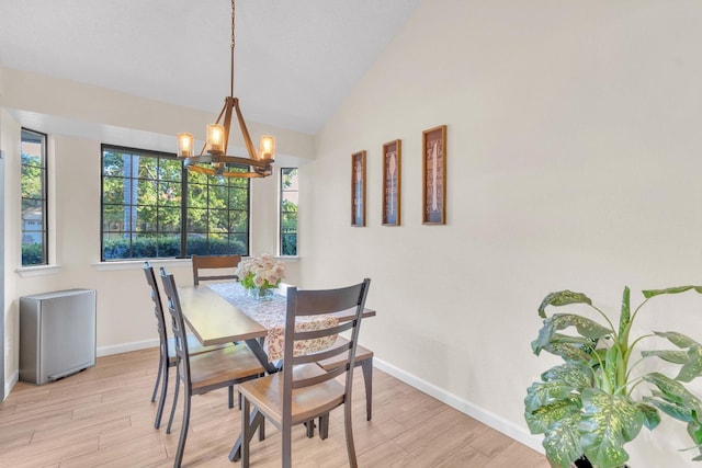 1750 E Deyoung, Fresno, CA 93720 - dining room featuring a chandelier, light wood finished floors, and lofted ceiling