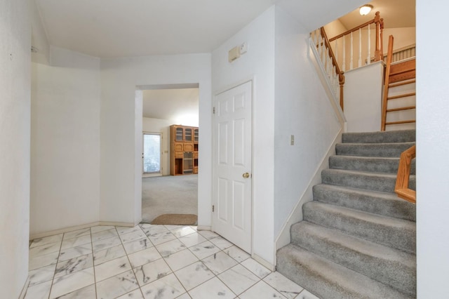 7664 N Kavanagh Ave, Fresno, CA 93711 - stairway with baseboards and marble look tiles