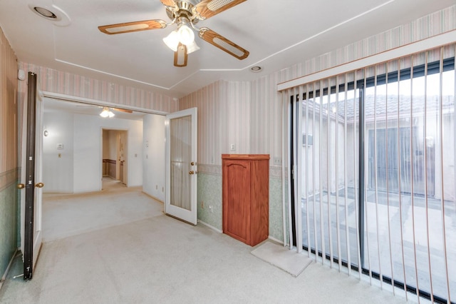 7664 N Kavanagh Ave, Fresno, CA 93711 - empty room with wallpapered walls, a ceiling fan, french doors, and carpet