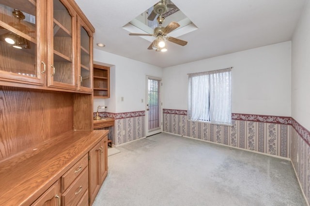 7664 N Kavanagh Ave, Fresno, CA 93711 - unfurnished office with wallpapered walls, a wainscoted wall, light carpet, and a ceiling fan