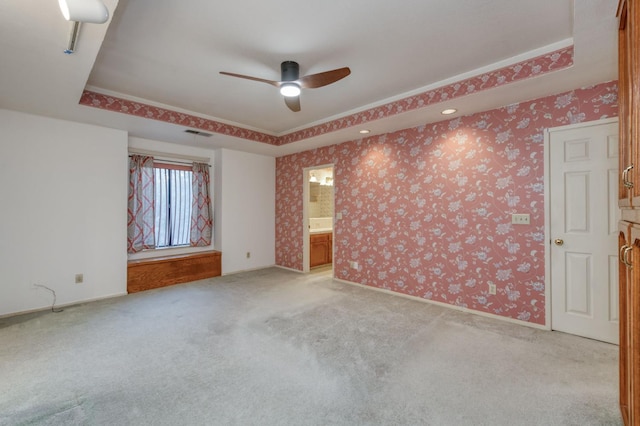 7664 N Kavanagh Ave, Fresno, CA 93711 - empty room with ceiling fan, a raised ceiling, and light colored carpet
