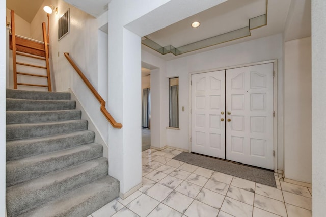 7664 N Kavanagh Ave, Fresno, CA 93711 - entryway with stairs and marble look tile flooring