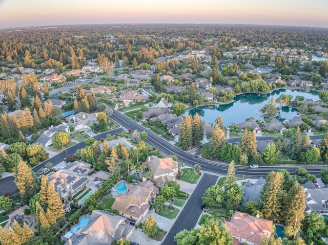 7664 N Kavanagh Ave, Fresno, CA 93711 - aerial view at dusk of a residential view and a water view