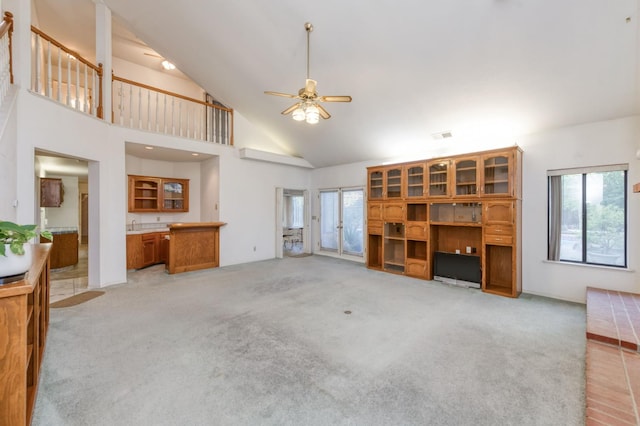 7664 N Kavanagh Ave, Fresno, CA 93711 - unfurnished living room featuring plenty of natural light, a ceiling fan, light carpet, and high vaulted ceiling
