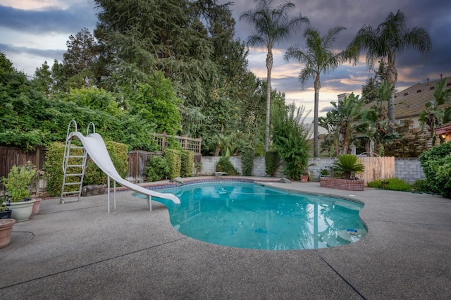 7664 N Kavanagh Ave, Fresno, CA 93711 - view of pool with a water slide, a fenced backyard, a patio area, and a diving board
