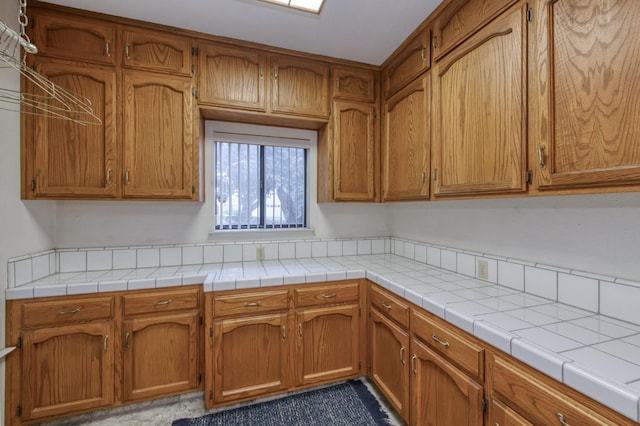 7664 N Kavanagh Ave, Fresno, CA 93711 - kitchen featuring brown cabinets and light countertops