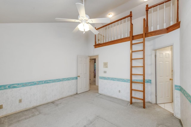 7664 N Kavanagh Ave, Fresno, CA 93711 - spare room with carpet flooring, ceiling fan, a towering ceiling, and a wainscoted wall