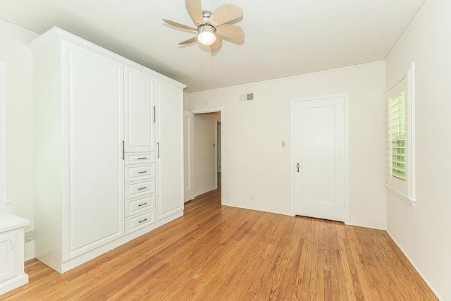 4845 Arcade Ave, Fresno, CA 93704 - unfurnished bedroom featuring light wood-style flooring and ceiling fan
