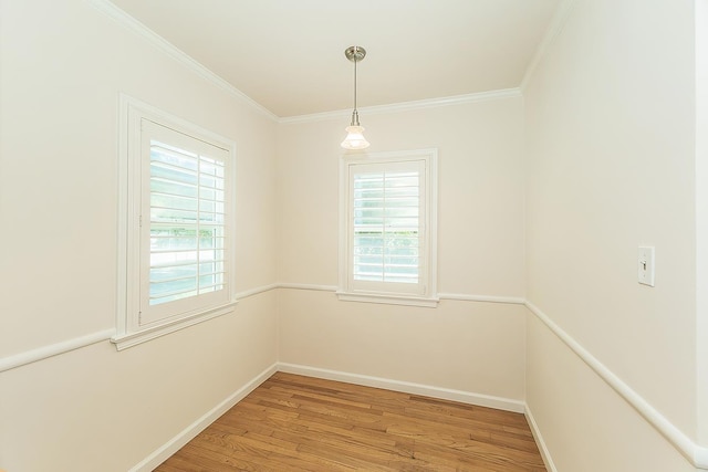 4845 Arcade Ave, Fresno, CA 93704 - empty room featuring healthy amount of natural light, light wood-style flooring, and ornamental molding
