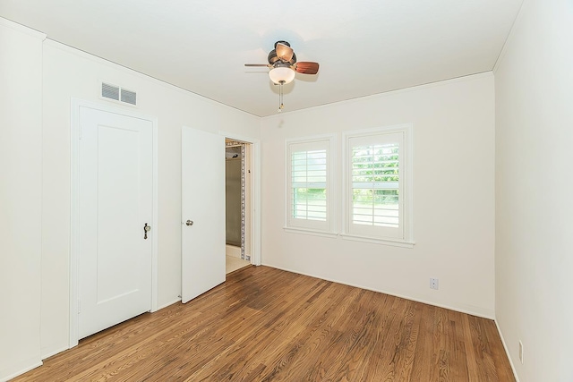 4845 Arcade Ave, Fresno, CA 93704 - unfurnished bedroom with wood finished floors and a ceiling fan