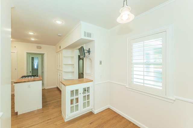 4845 Arcade Ave, Fresno, CA 93704 - unfurnished dining area with ornamental molding, light wood-style flooring, and recessed lighting