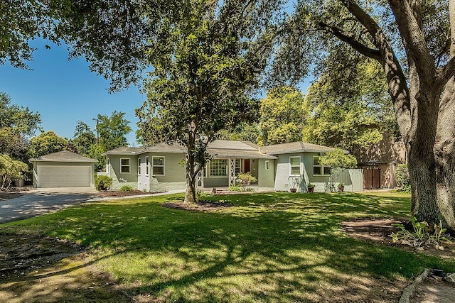 4845 Arcade Ave, Fresno, CA 93704 - view of front of home with an outdoor structure, a front yard, a detached garage, and stucco siding